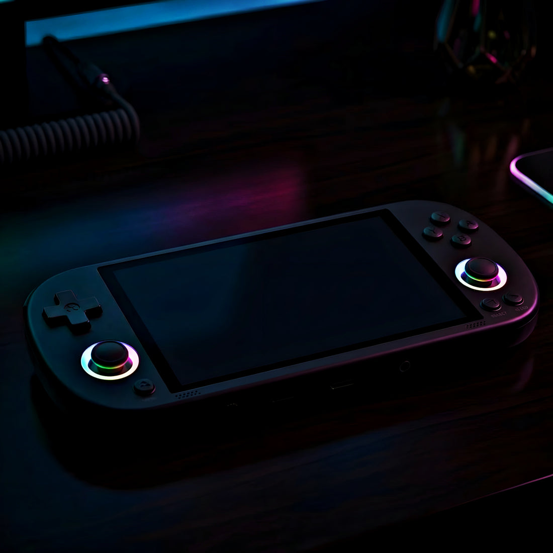 Gaming console with colorful lighting on a dark surface